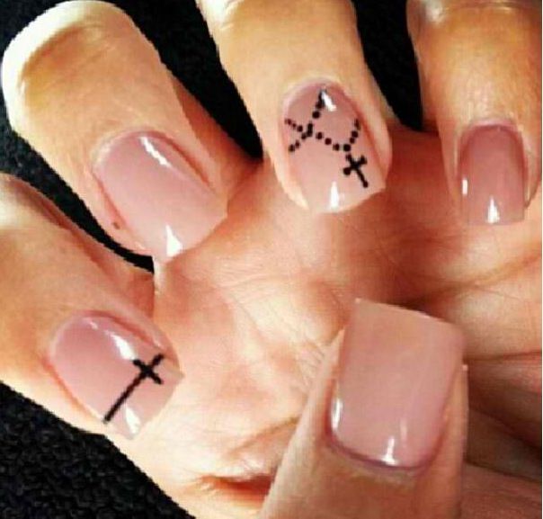 Elegant Nude Nail Design with Minimalist Accents and Unique Crosses.