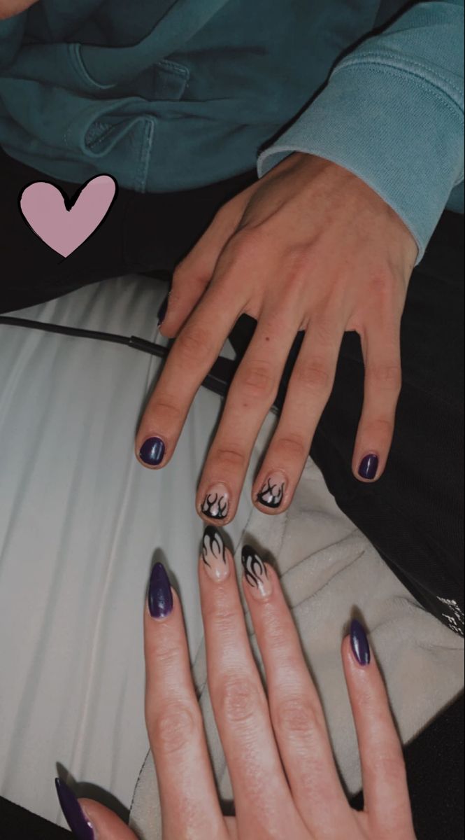 Bold Deep Purple Nail Design with Intricate Flame Patterns and Elegant Matte White Tips.