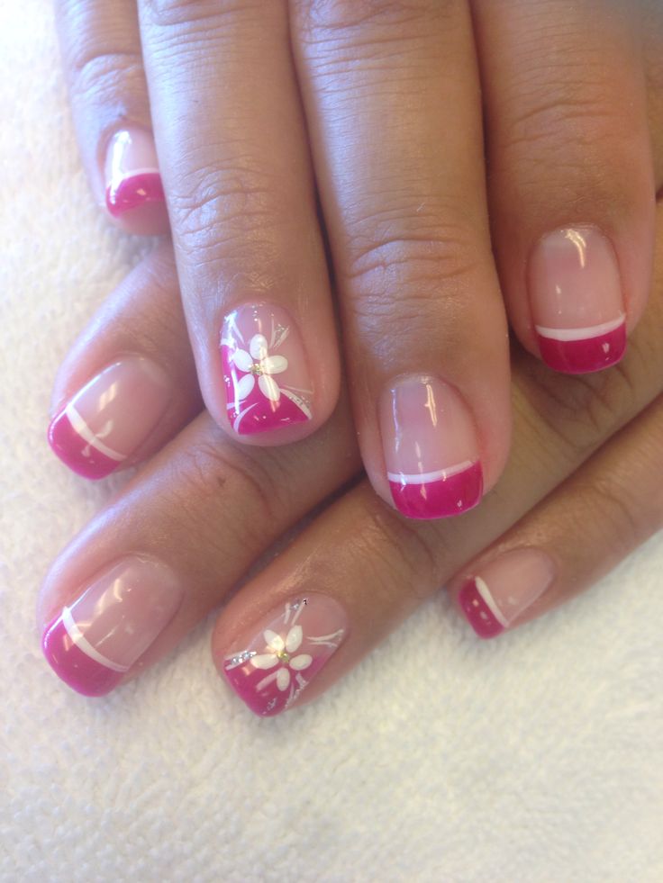 Chic Nail Design: Soft Pink and Bold Fuchsia with Delicate Floral Accents.