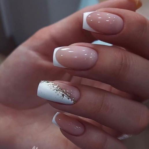 Timeless Glamour: Elegant French Tip Nail Design with Gold Glitter Accents