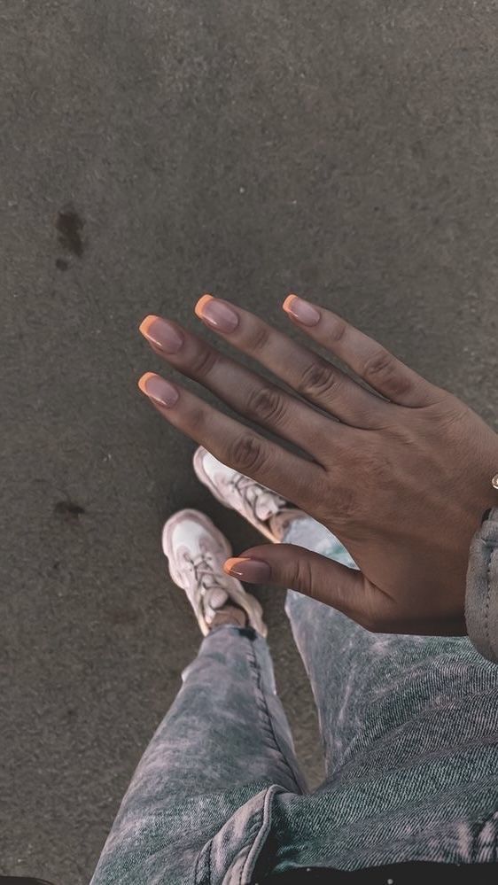 Chic Almond-Shaped Nails: Nude Base with Vibrant Peach Tips for Versatile Style