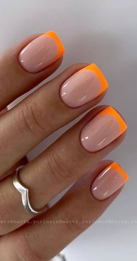 Modern Chic: Vibrant Nude and Orange French Manicure Design.