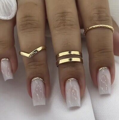 Sophisticated Long Square Nails with Sheer Nude Base and Silver Glitter Accents.