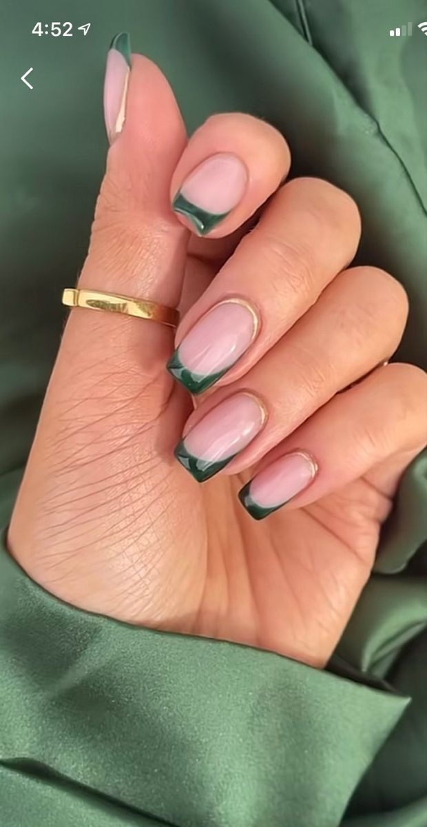 Chic Soft Nude Nails with Bold Green Tips for Sophisticated Style.