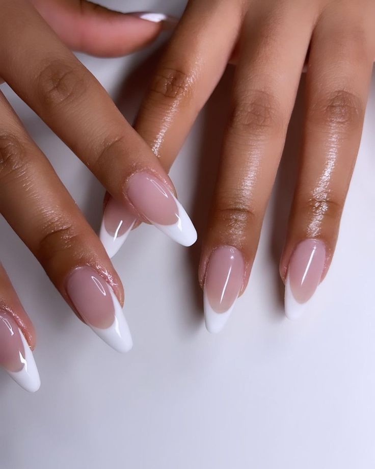 Sophisticated Soft Pink and White Tip Nail Design: A Modern Take on Classic French Manicure.