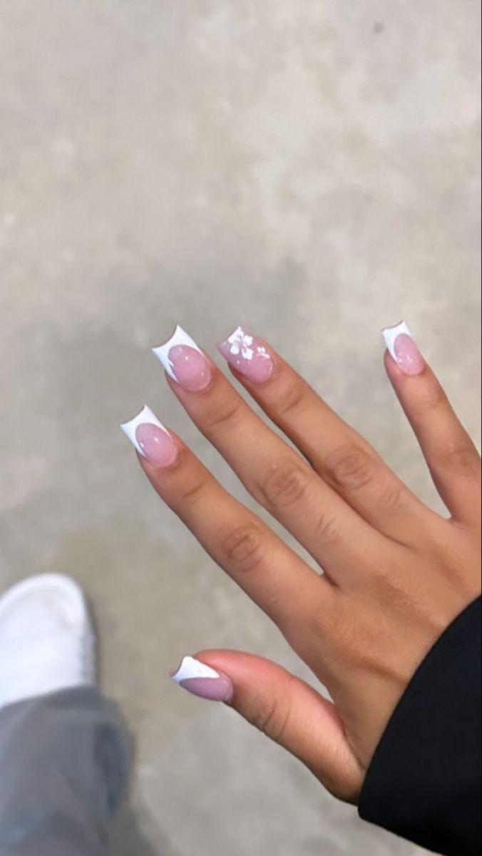 Chic French Tip Manicure with Soft Pink Base and Delicate Floral Accents