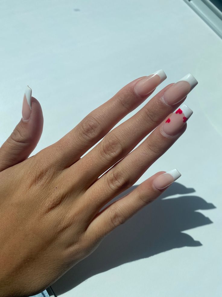 Chic Long French Tip Nail Design with Glossy Finish and Playful Red Accents