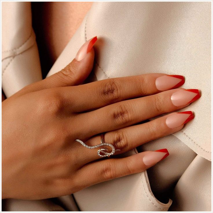 Chic Almond-Shaped Nails with Nude and Red Tips: A Sophisticated Look for Any Occasion