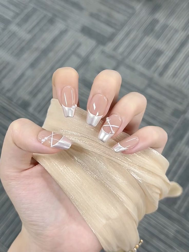 Chic Modern French Tip Nail Design with Geometric Accents.