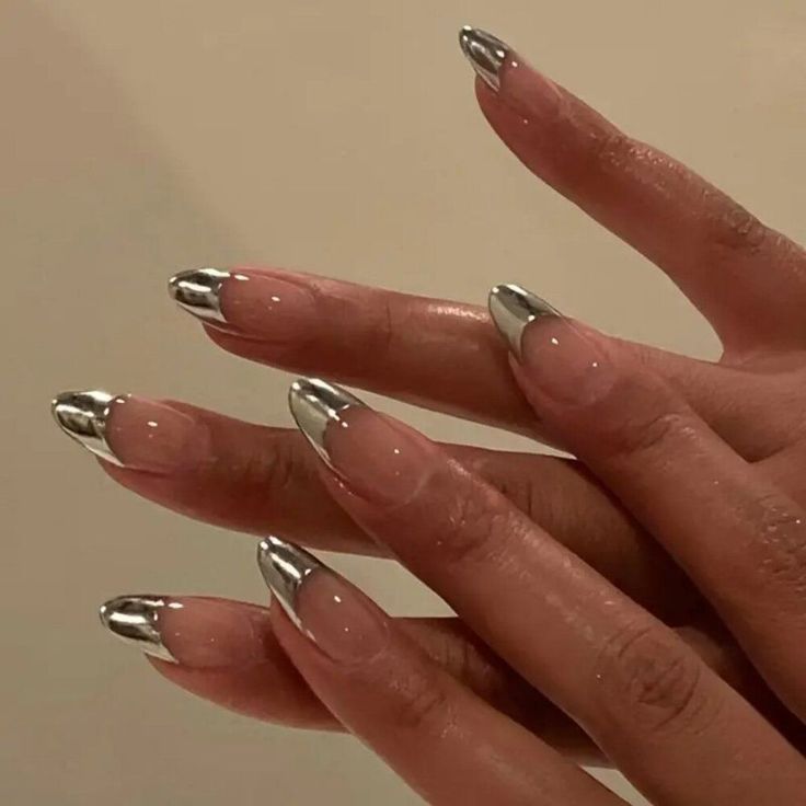 Sophisticated Metallic Nail Design with Sleek Silver Tips and Elegant Contrast.