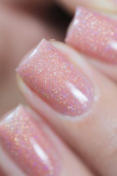 Mesmerizing Glittery Peach Nail Design with Holographic Sheen for Every Occasion