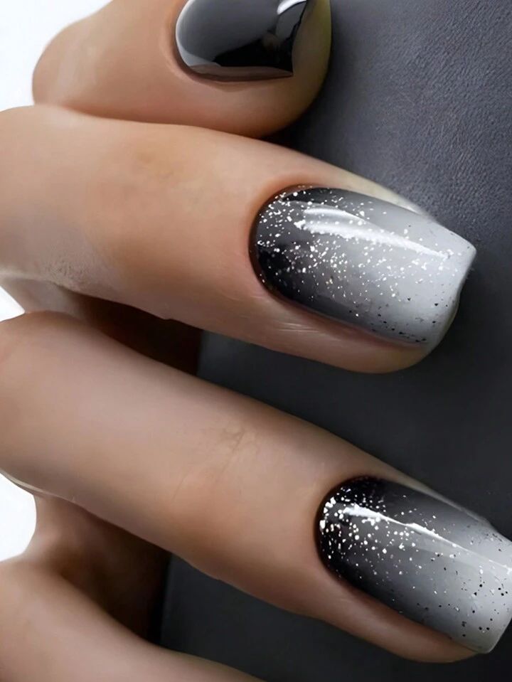 Chic Gradient Nails: Elegant Black and Gray Ombre with Sparkling Silver Accents.