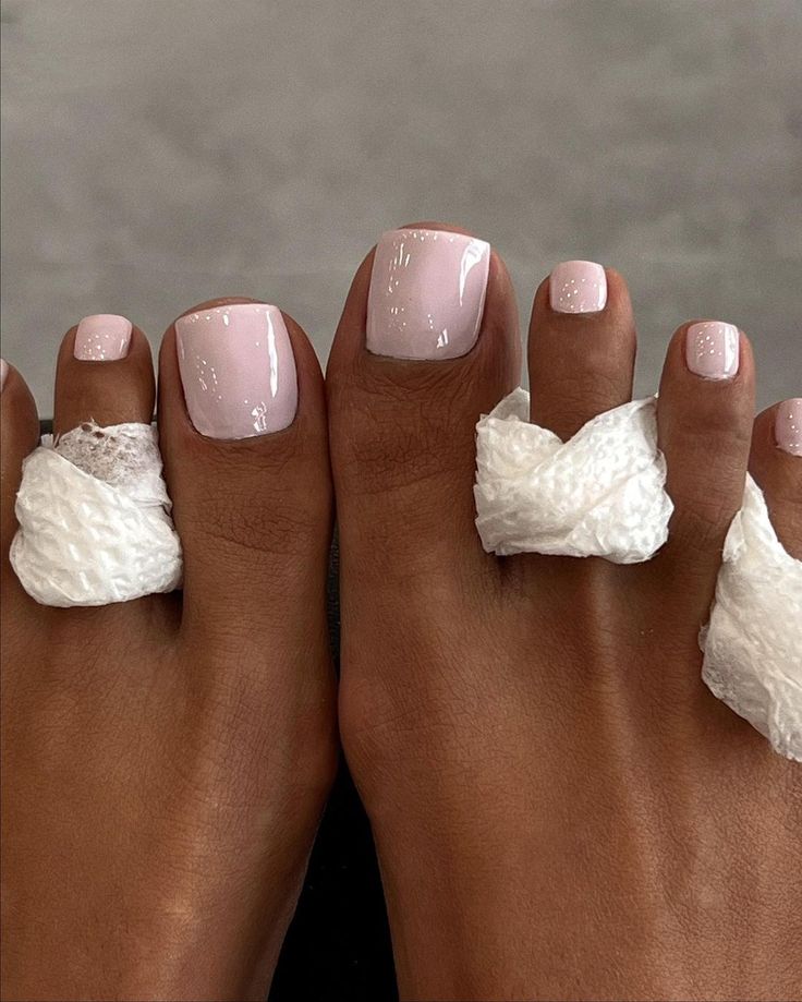 Sophisticated Light Pink Pedicure: A Perfect Blend of Elegance and Professionalism.