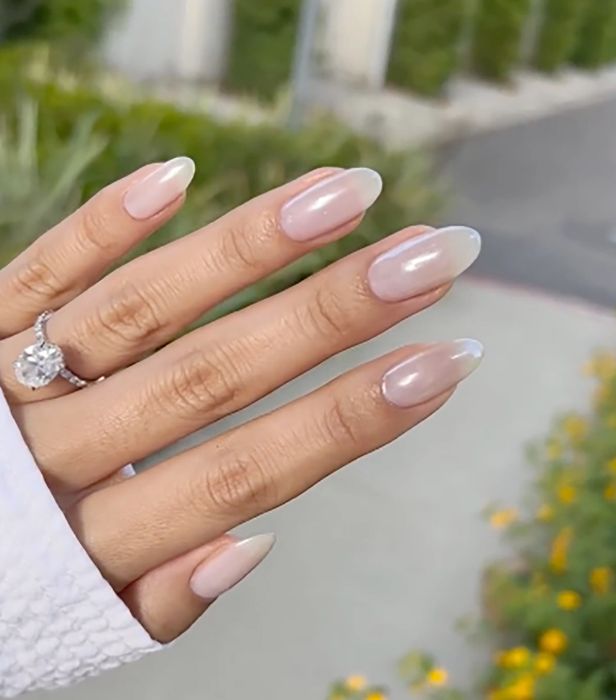 Sophisticated Ombre Nail Design with Sheer Pink Base and Delicate White Tips.