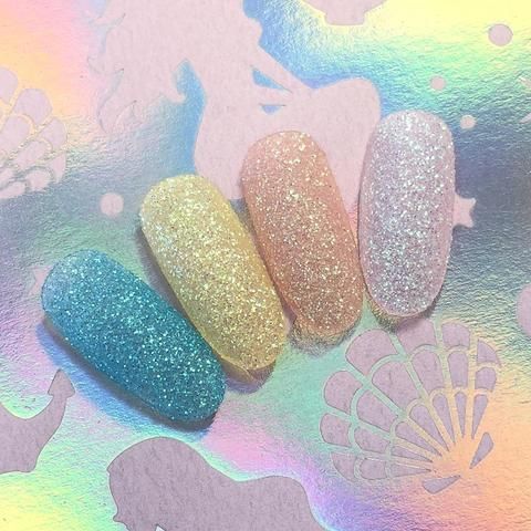 Whimsical Glittery Pastel Nail Designs for Playful Elegance.