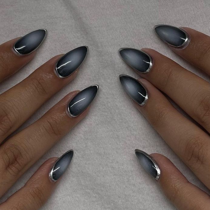 Sleek Ombre Nail Design with Gradient Gray, Glossy Finish, and Silver Accents for a Glamorous Look.