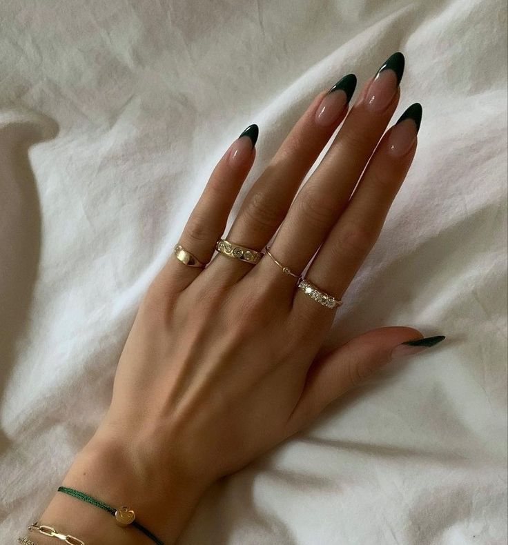 Chic Almond-Shaped Nails with Striking Nude and Dark Green French Tip Design