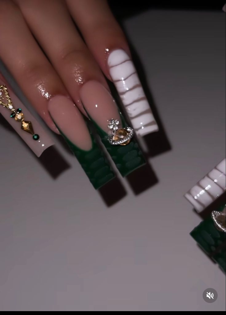 Elegant Nail Design with Colorful Contrast and Glamorous Embellishments.