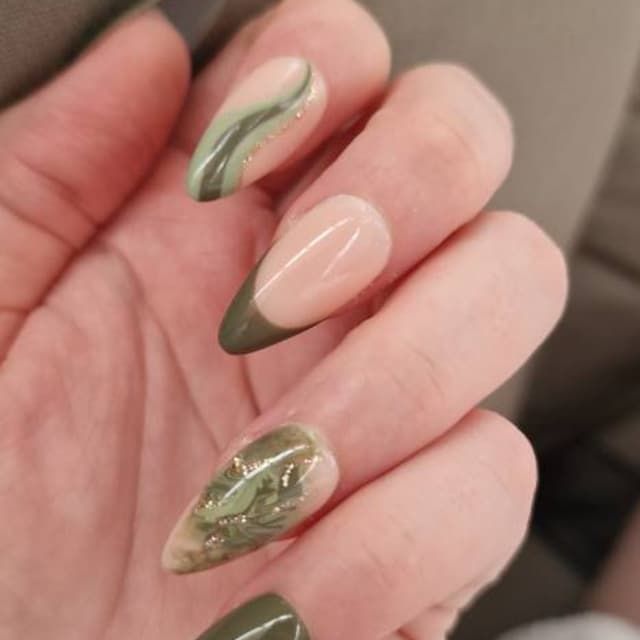 Sophisticated Nail Design with Soft Green Tones and Abstract Swirls for a Modern Touch.