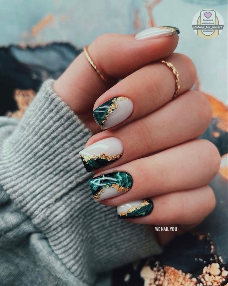 Sophisticated Nail Design: Muted Tones with Bold Accents and Natural Patterns.