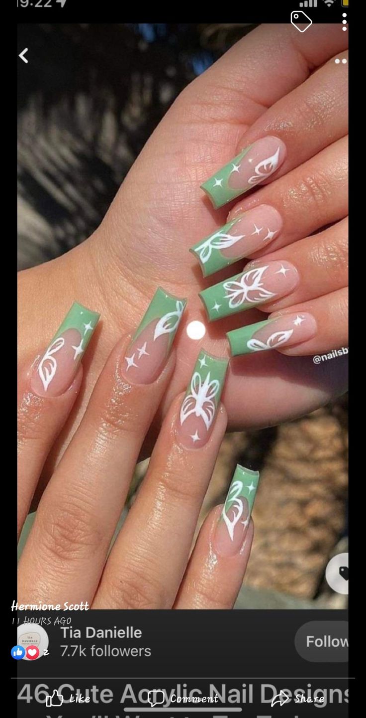 Elegant Green Floral Nail Design with Whimsical French Tips.