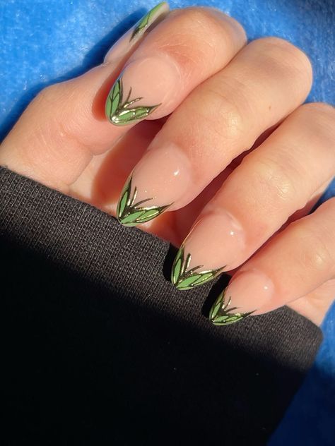 Elegant Nude Nail Design with Vibrant Green Leaf Accents