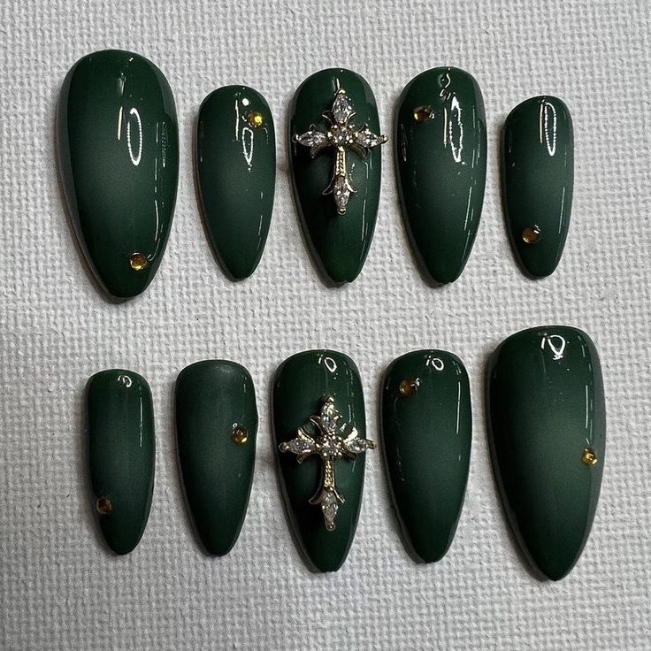 Sophisticated Green Matte Nails with Silver Cross and Rhinestone Accents