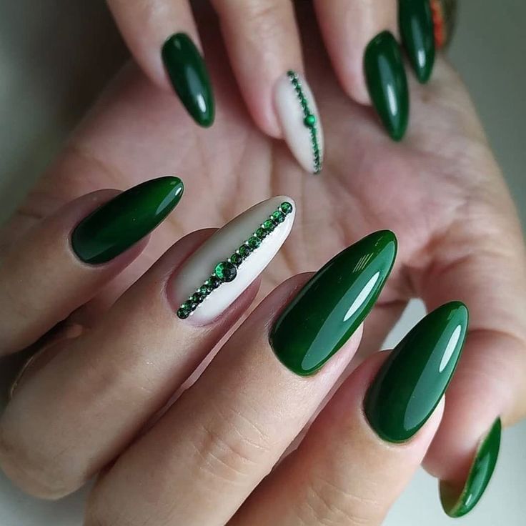 Chic Almond-Shaped Green Nails with Glamorous Rhinestone Accent