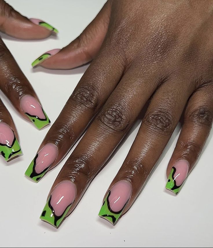 Bold Nail Design: Vibrant Pink and Green with Stylish Edges and Black Accents.