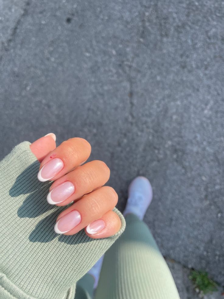 Sophisticated Soft Pink French Tip Manicure: Timeless Elegance with a Modern Twist.