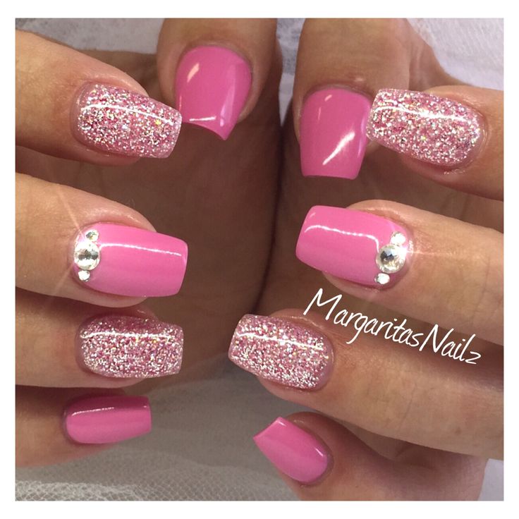 Playful Elegance: Vibrant Pink Glitter Nails with Rhinestones.