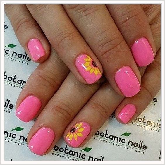 Cheerful Floral Manicure with Vibrant Pink Nail Polish and Playful Yellow Accents.