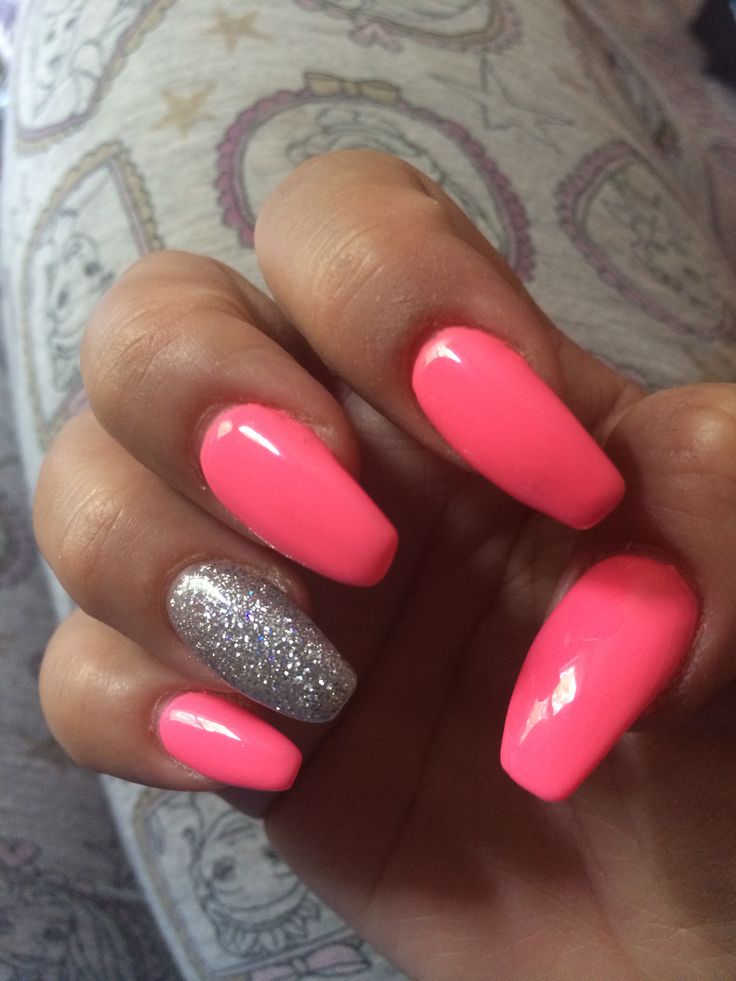 Vibrant Pink Nails with Glittery Accent: A Perfect Blend of Fun and Glamour.