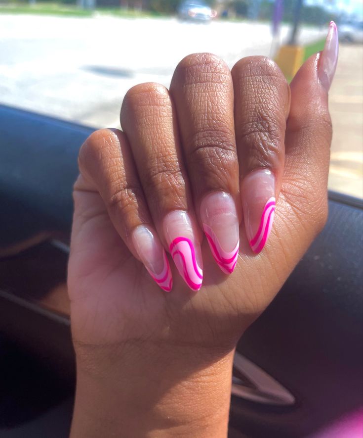 Elegant Colorful Nail Design with Bold Pink Swirls on Clear Base