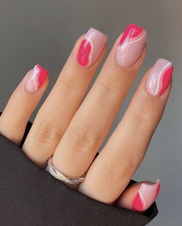 Chic and Playful Colorful Abstract Marble Nail Design in Soft Pink and Vibrant Red.