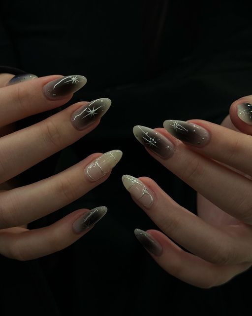 Elegant Gradient Nail Design with Sparkling Star Accents and Chic French Tips.