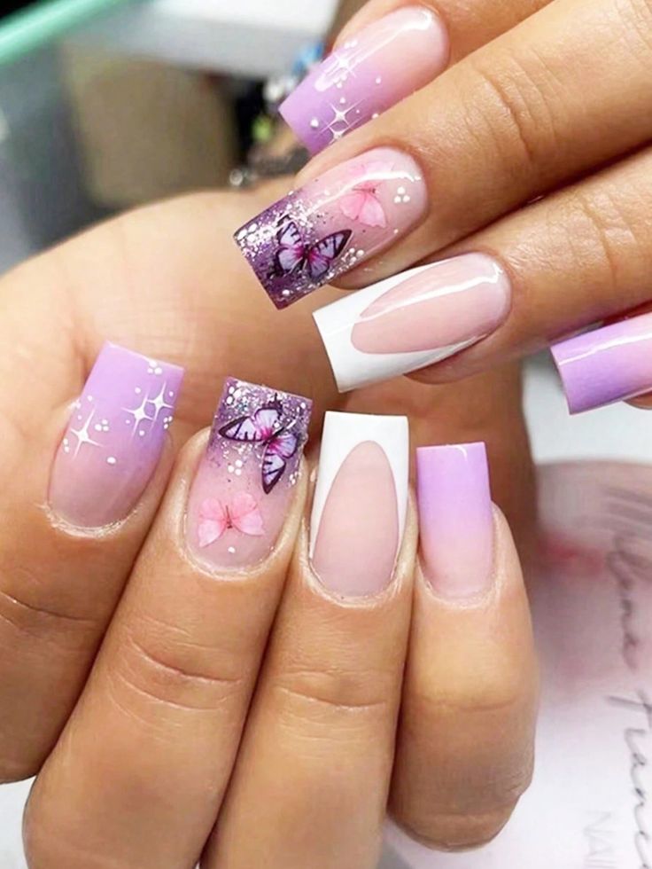 Whimsical Pastel Purple and Pink Nail Design with Butterfly Patterns and Floral Accents.