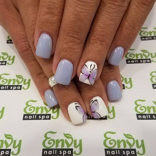 Sophisticated Lavender Nail Design with Chic White Accents and Delicate Butterfly Illustration.