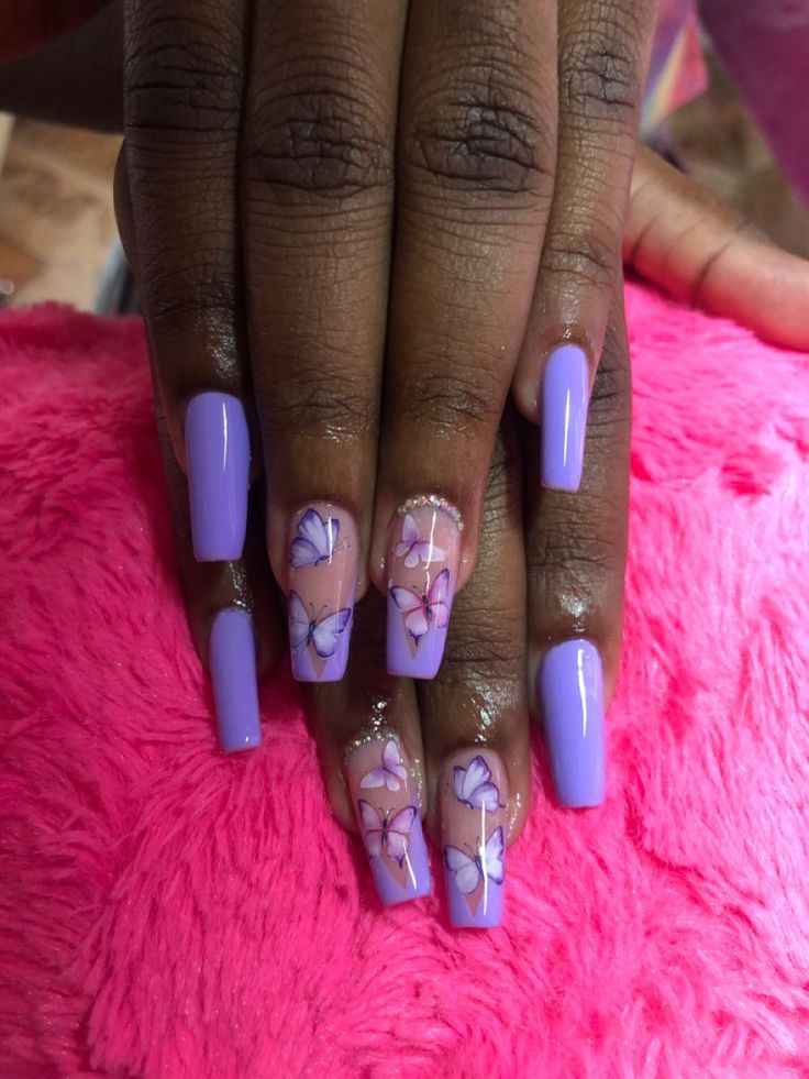 Whimsical Elegance: Lavender Nail Design with Hand-Painted Butterfly Motifs.