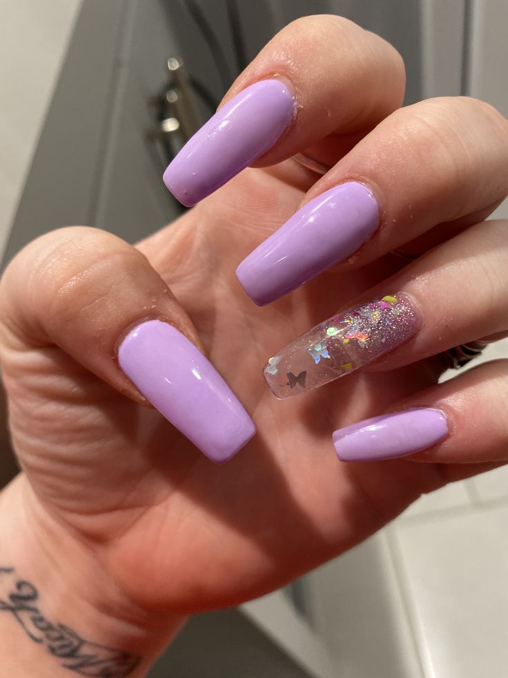 Whimsical Elegant Lavender Nails with Glitter and Butterfly Accents