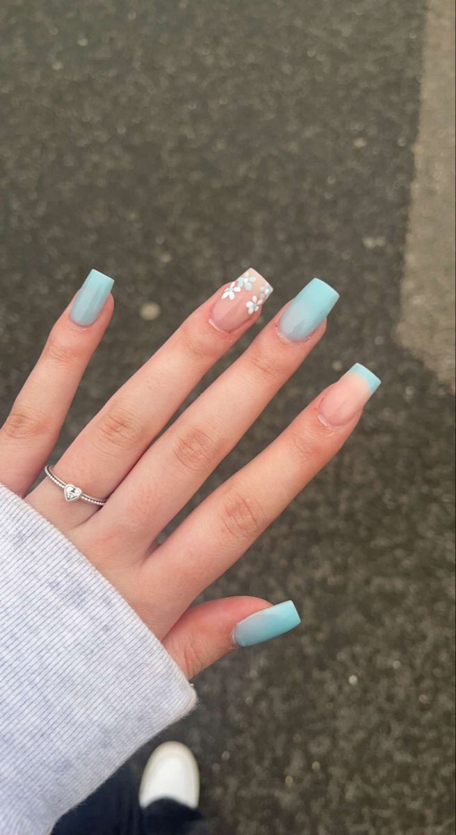 Chic Pastel Blue Square Tip Nails with Elegant White Floral Accent Design.