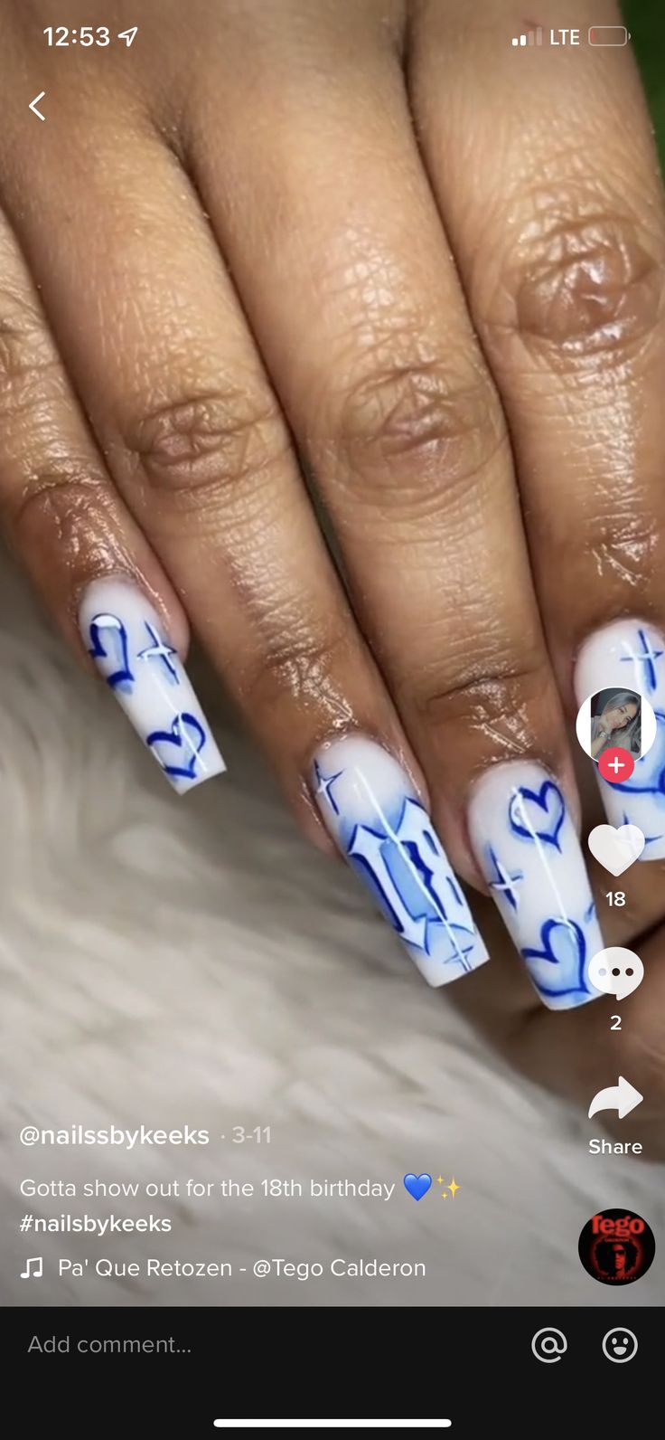 Vibrant Nail Design: Playful Blue Hearts and Delicate Crosses for Whimsical Celebrations