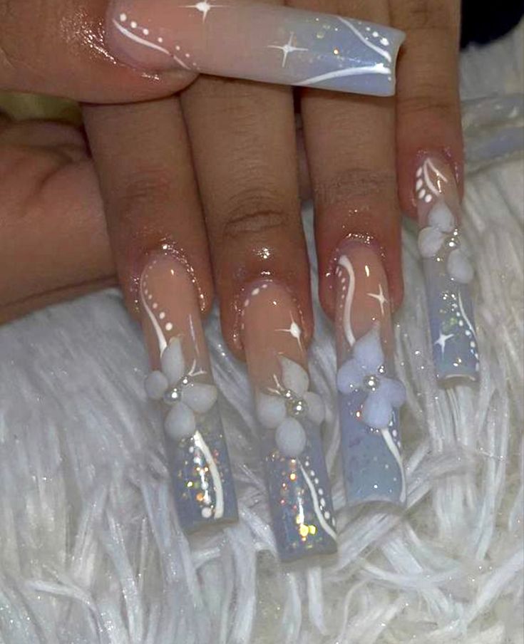 Chic Pastel Nail Design with Floral Accents and Intricate Detailing.