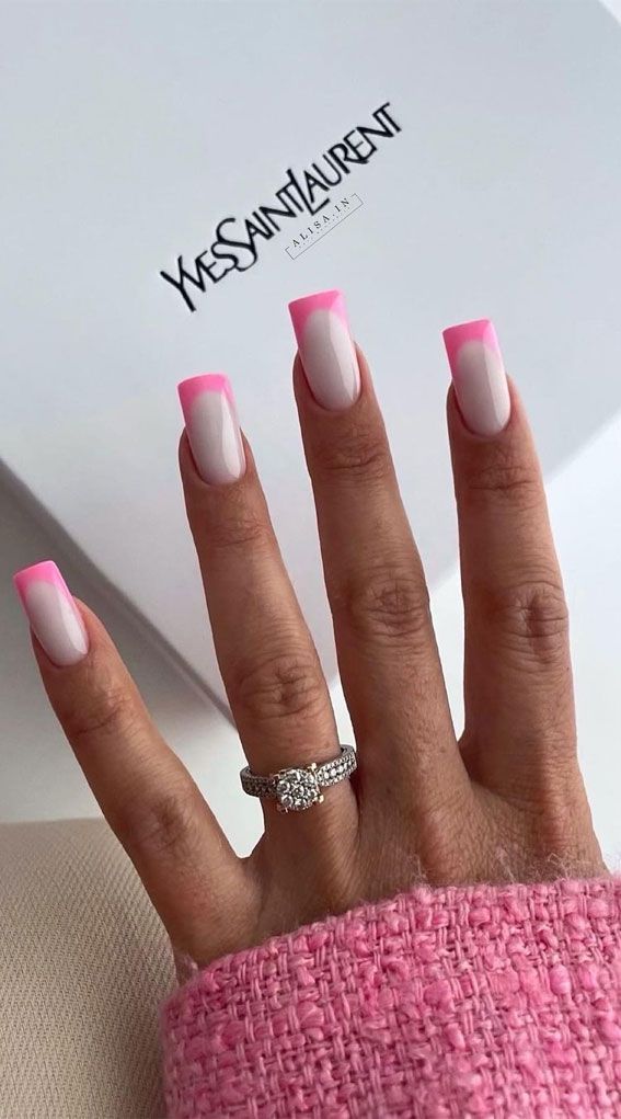 Stylish French Tip Nail Design with Vibrant Pink Edge on Nude Base.