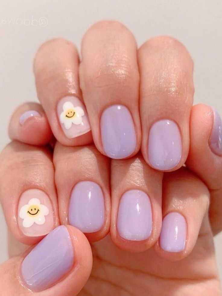 Playful Pastel Lavender Nails with Cheerful Flower Accents for Whimsical Style