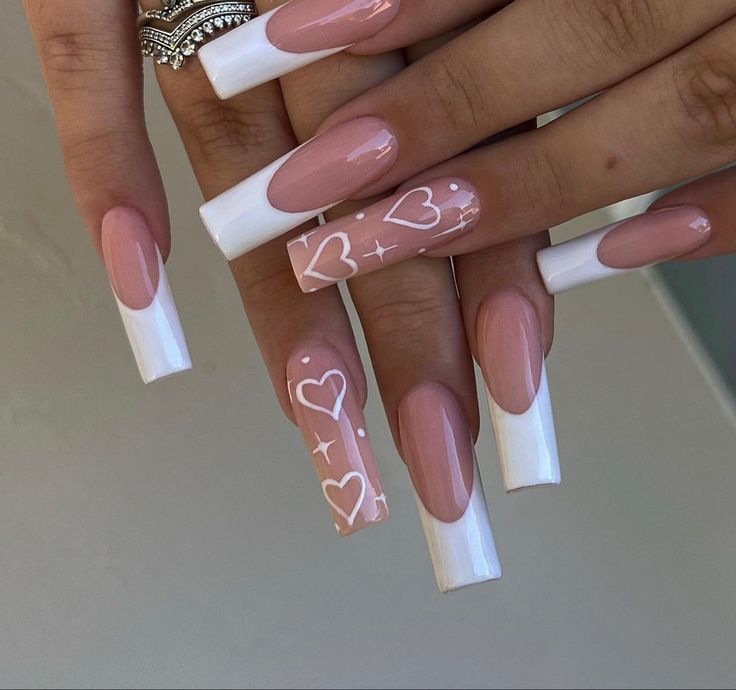 Elegant Nude and White Nail Design with Heart and Star Motifs