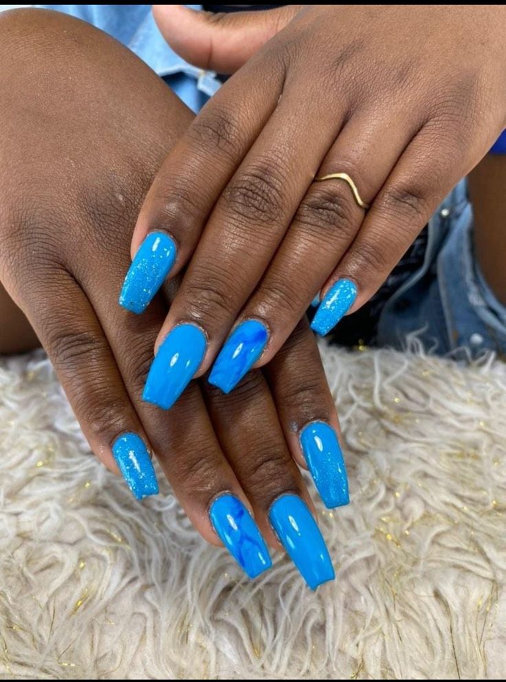 Chic Vibrant Blue Nail Design with Glossy and Glitter Finishes