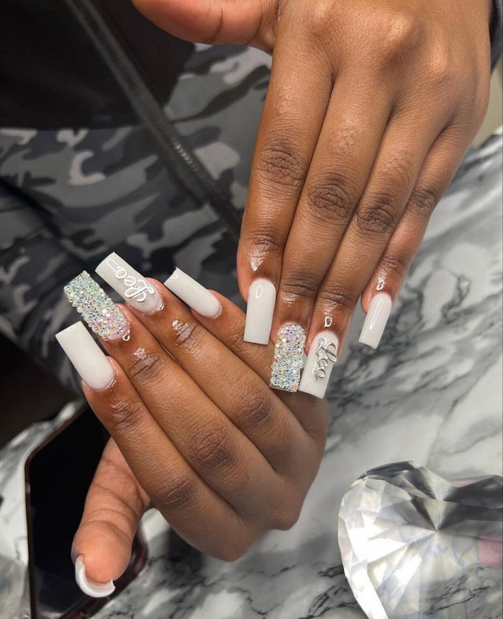 Sophisticated Nail Design: Matte White Meets Iridescent Glitter for a Modern Look.