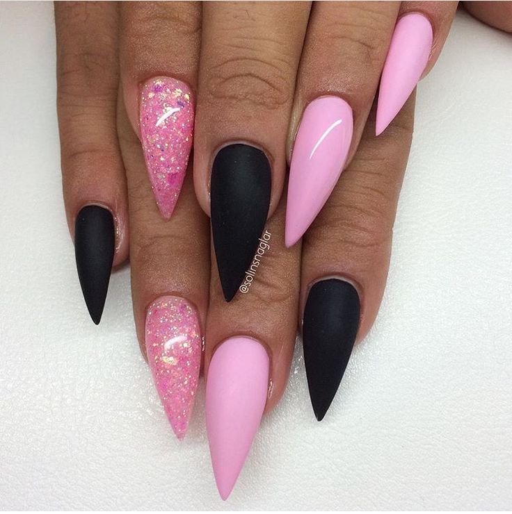 Chic Stiletto Nails: Matte Black and Glossy Pink with Glittery Accents