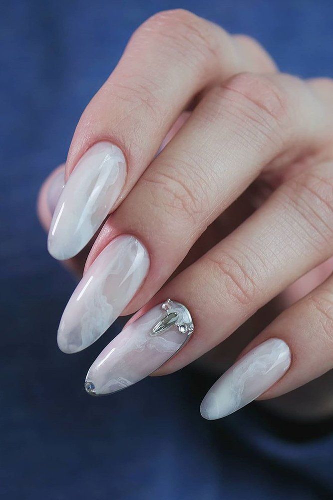 Chic Marble-Inspired Nail Design with Translucent Base and Silver Accent.